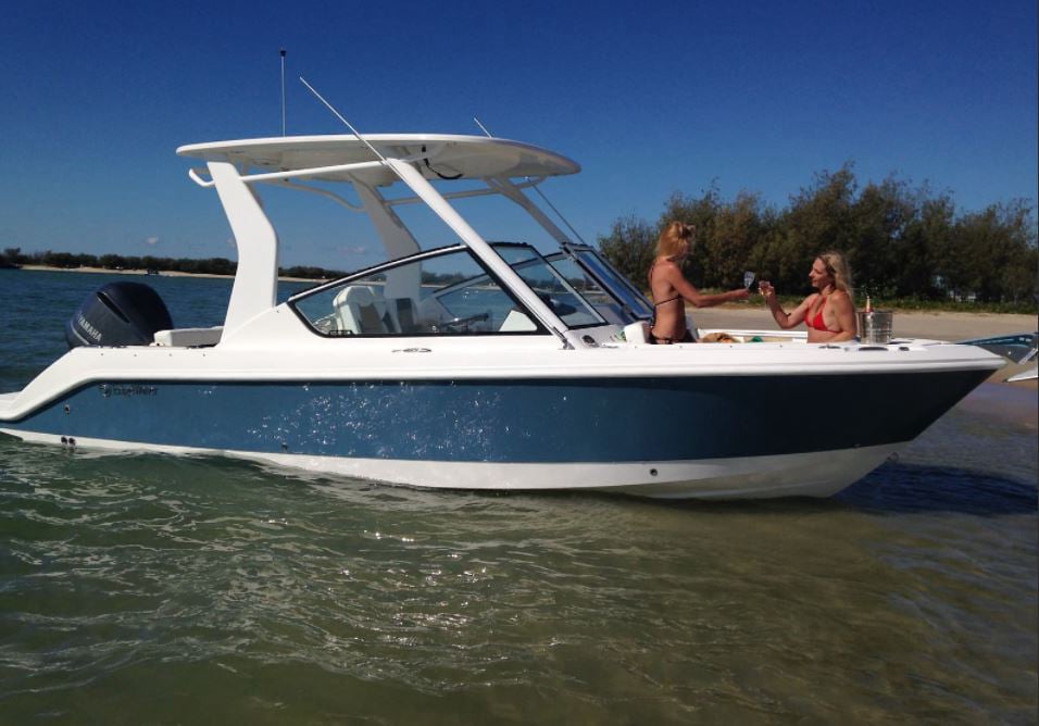 Family enjoying fishing and cruising on an EdgeWater 230CX in the Great Barrier Reef.